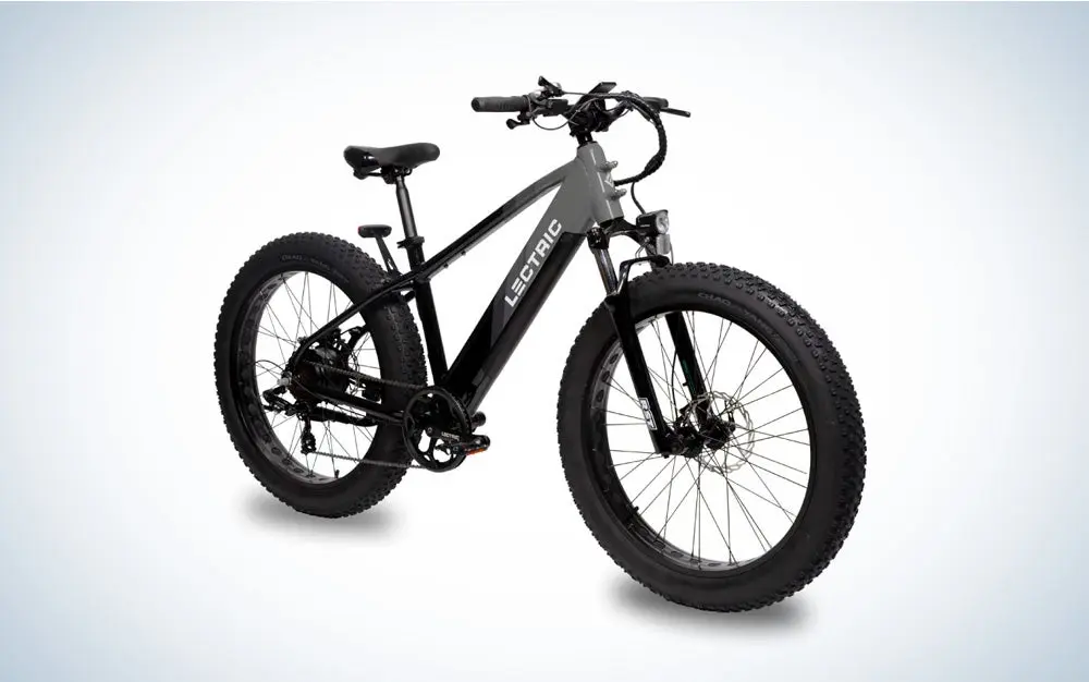 A grey and black Lectric X-Peak ebike on a black and white gradient background.