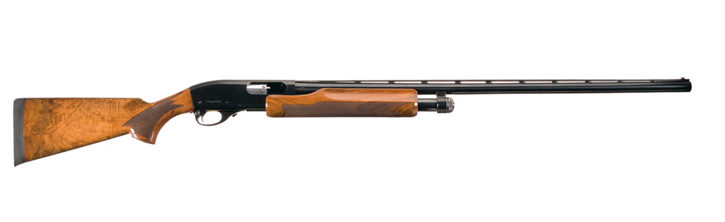 Remington 870 Competition Trap pump shotgun on a white background.