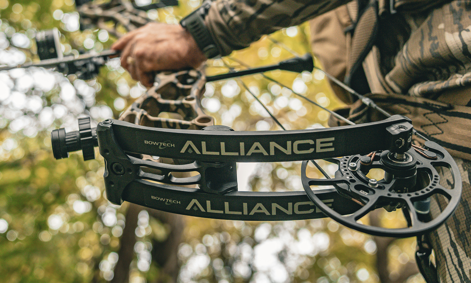 A hunter holds the new Bowtech Alliance compound bow. 