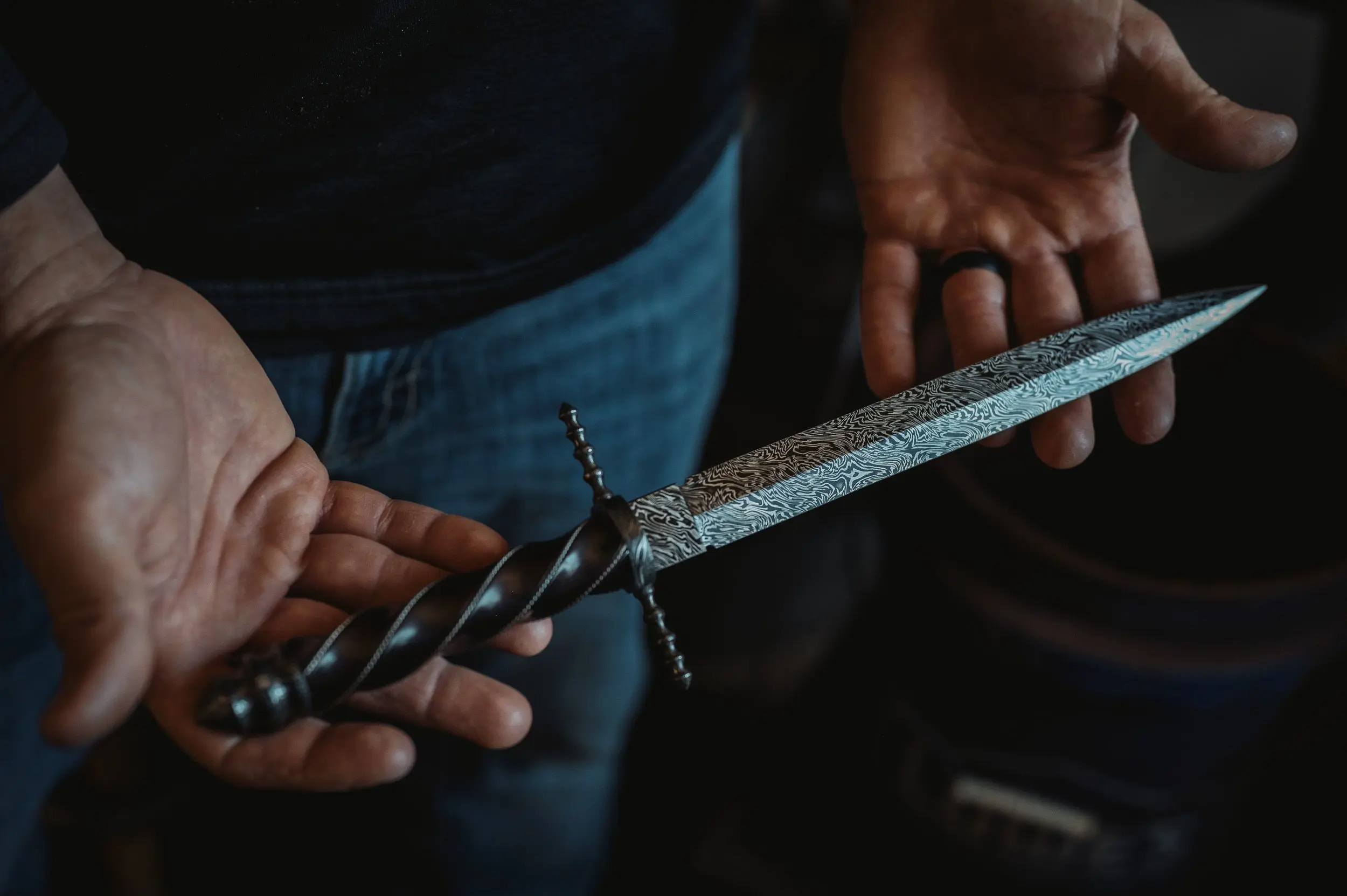 A knife maker displays a custom knife. 