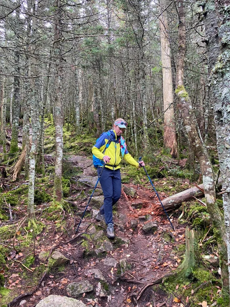 woman using the best trekking poles downhill