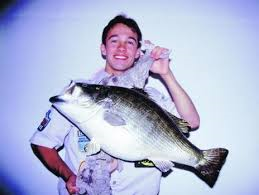 An angler poses with the Colorado record for largemouth bass. 