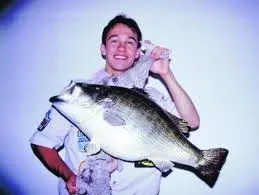 An angler poses with the Colorado record for largemouth bass. 