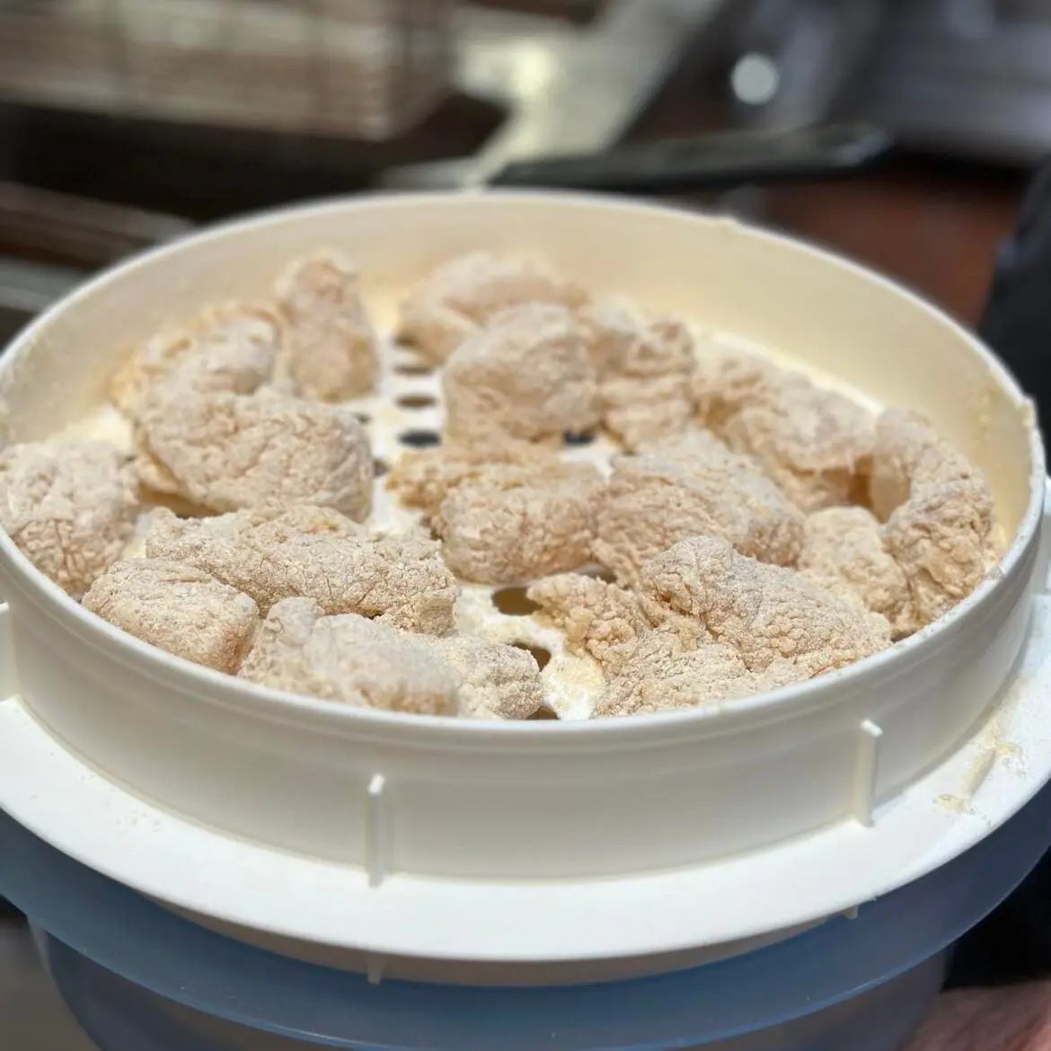 Photo of fish being prepared to be deep fried