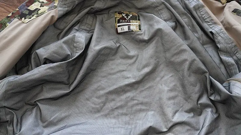 The gray inside lining of the Forloh AllClima rain jacket with the tag clearly visible. 