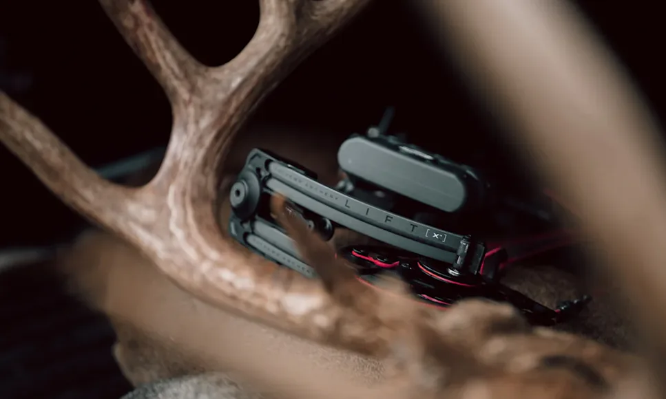 The new Mathews Lift X compound bow with deer antlers in foreground.
