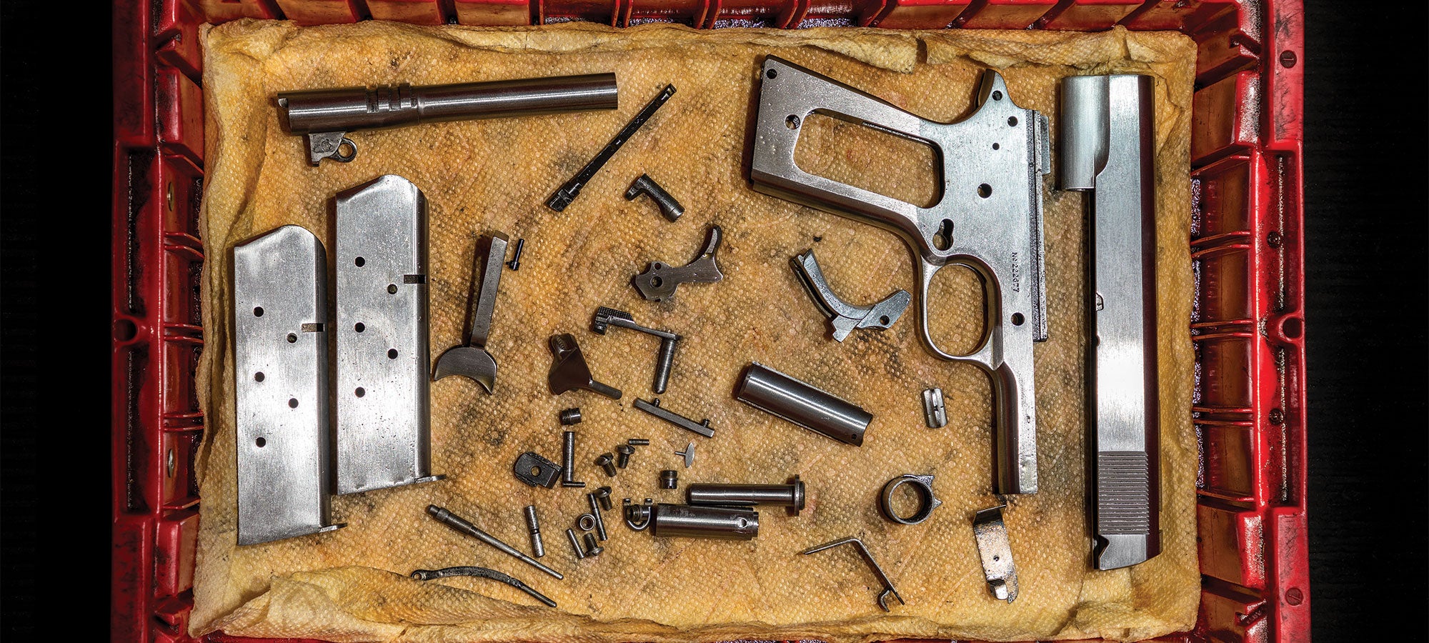 httpswww-fieldandstream-comsitesfieldandstream-comfilesimages201903parts-of-colt-1911-disassembled-2000x900-jpg