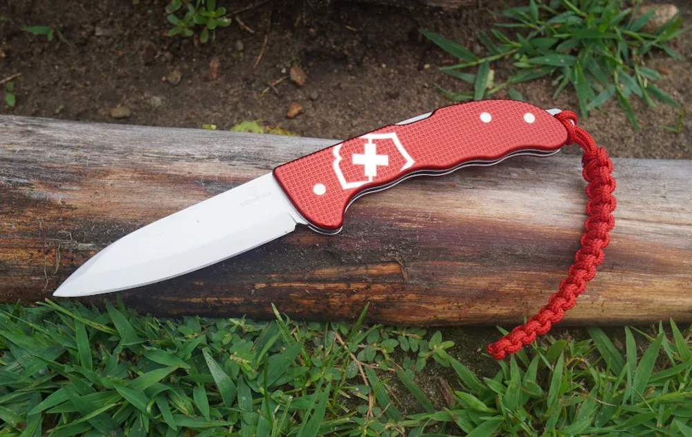 Victorinox Hunter Pro Alox knife laying on grass