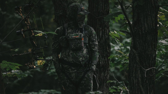 Bowhunter in treestand wearing Sitka Optifade Cover camo