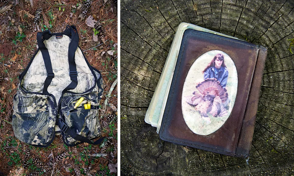A turkey vest sitting on the ground and a wallet with a photo of a woman posting with a turkey