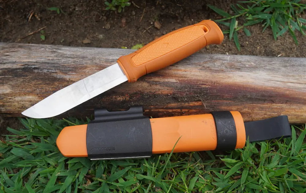 Morakniv Kansbol knife laying on grass