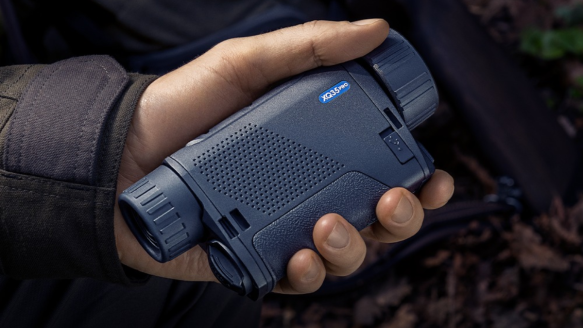 Man holding Pulsar Axion Thermal Monocular