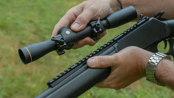 photo of lever-action rifle and scope