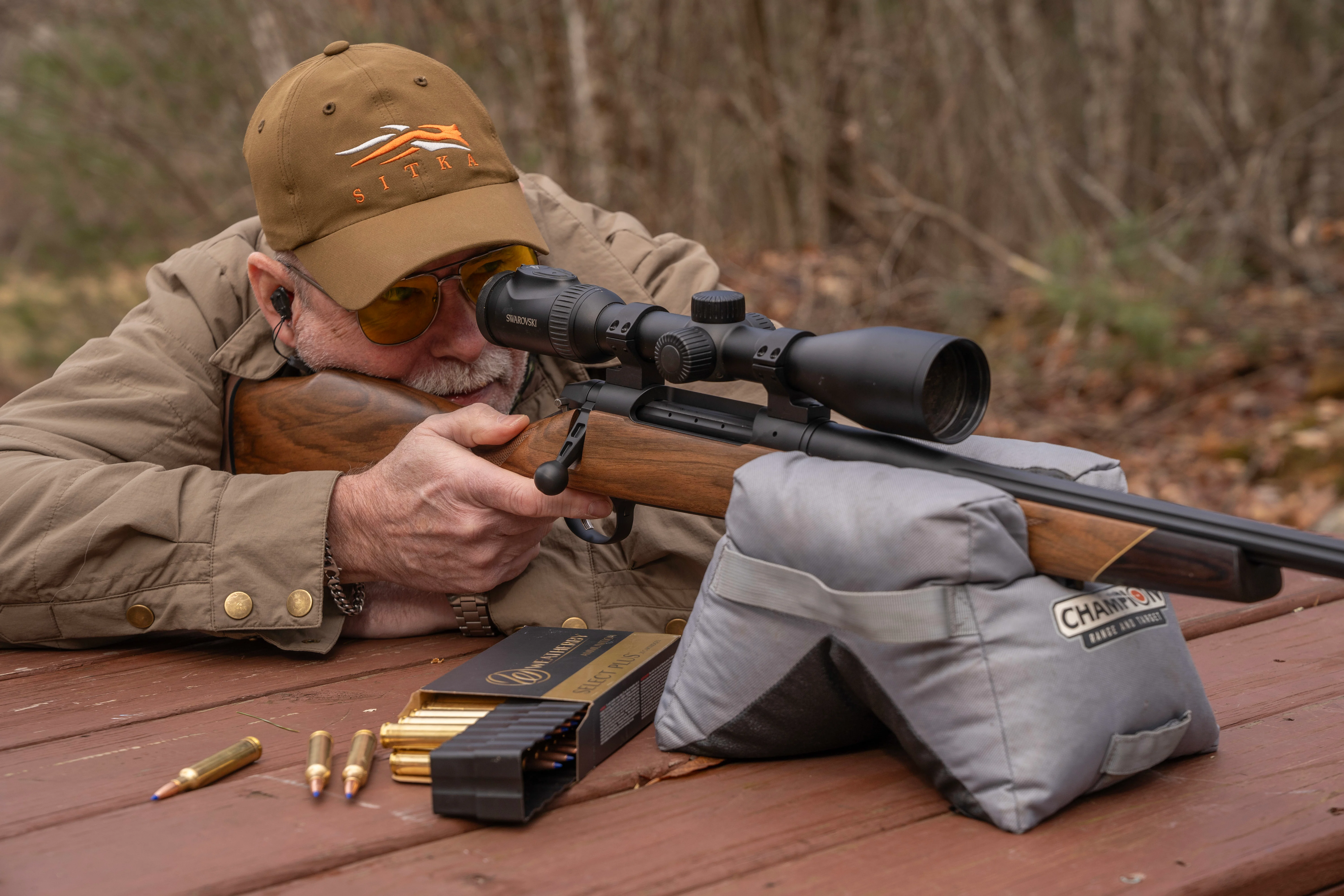 A shooter fires the new Weatherby Model 307 Adventure SD rifle from a bench rest. 