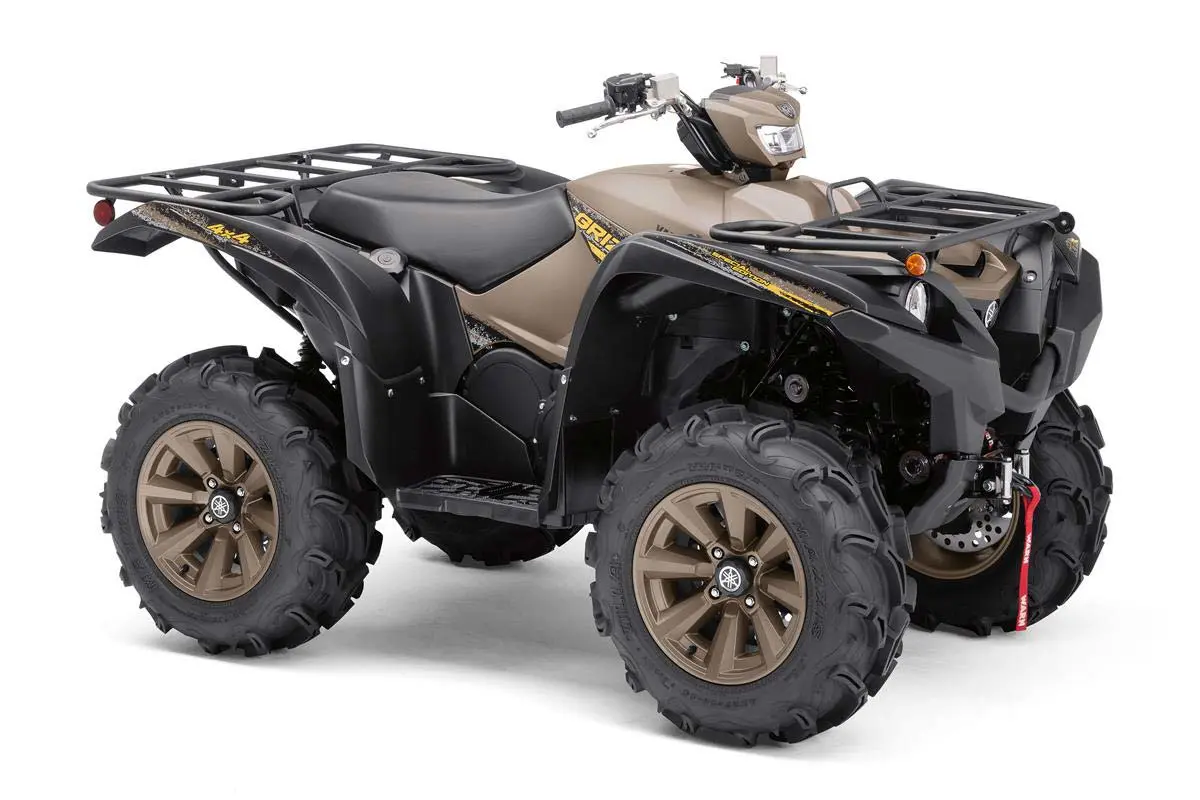 A brown and black Yamaha Grizzly ATV on a white background.