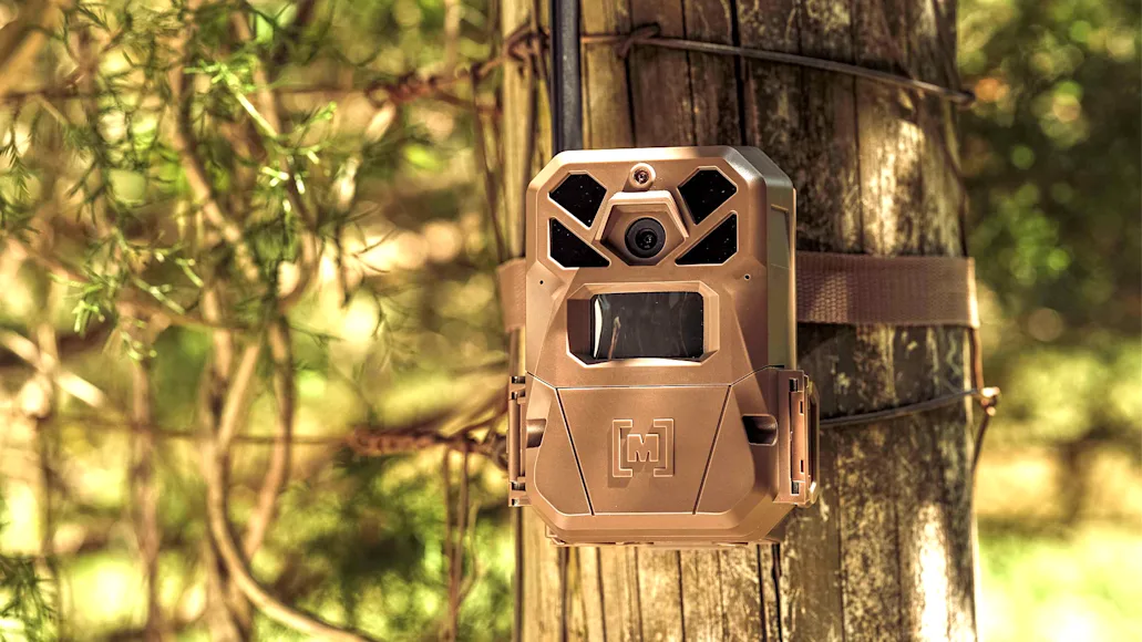 Moultrie Mobile Edge Pro 2 trail camera attached to a fence post.