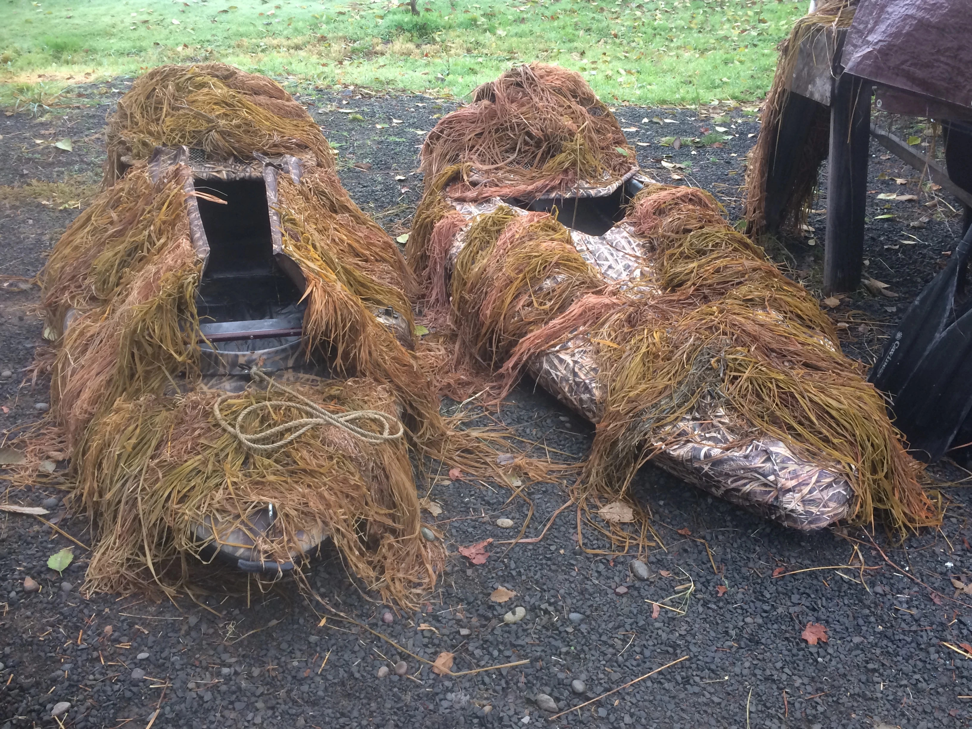 Two Aquapod duck hunting boats with grass attached