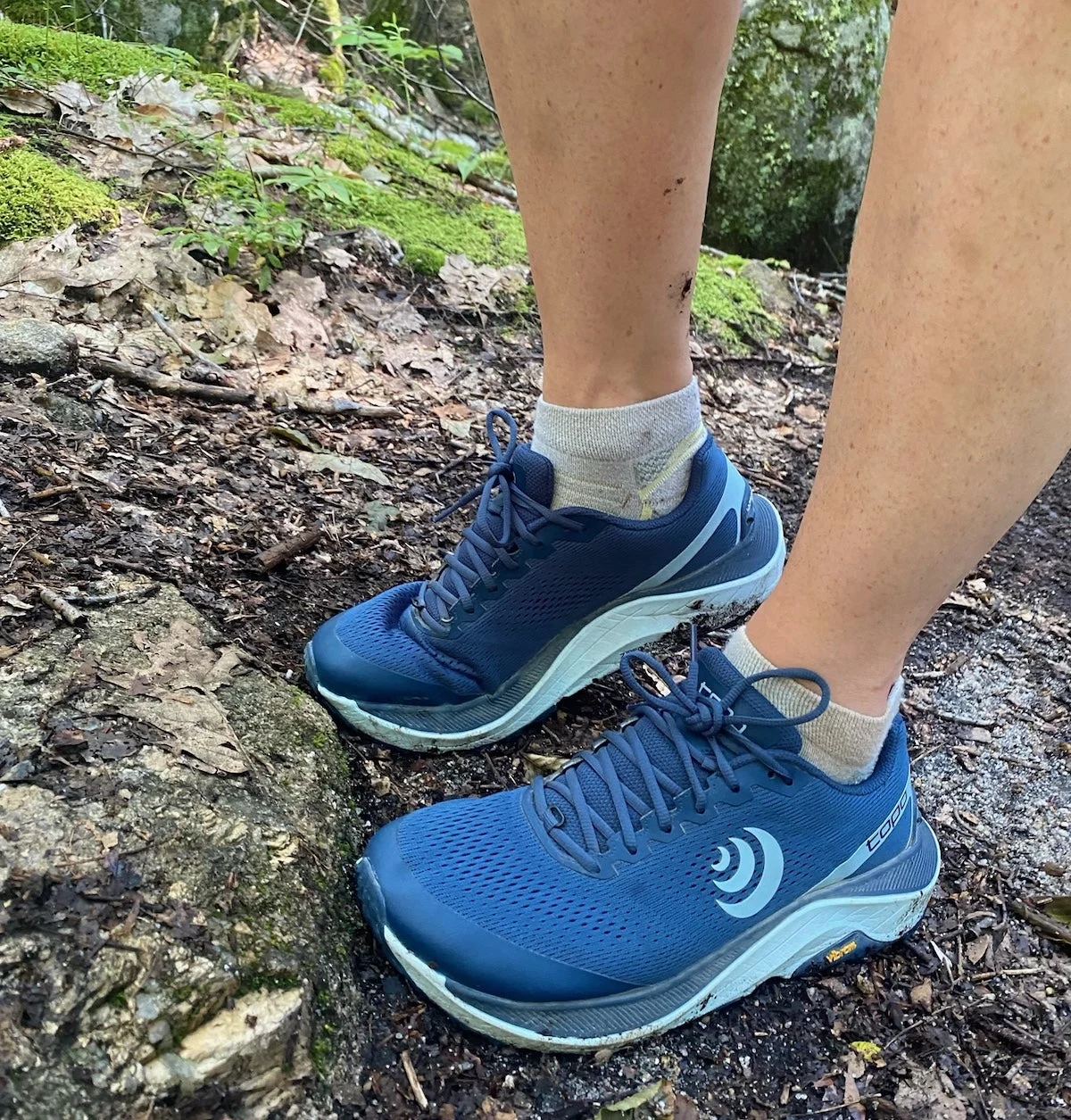 Woman wearing Topo Ultraventure 3 on the trail