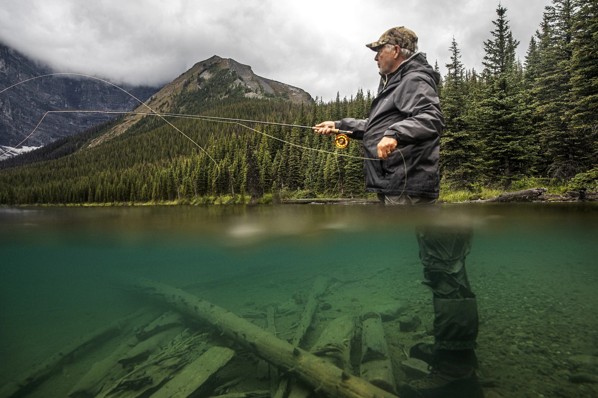 fly-fisherman-casting-in-lake