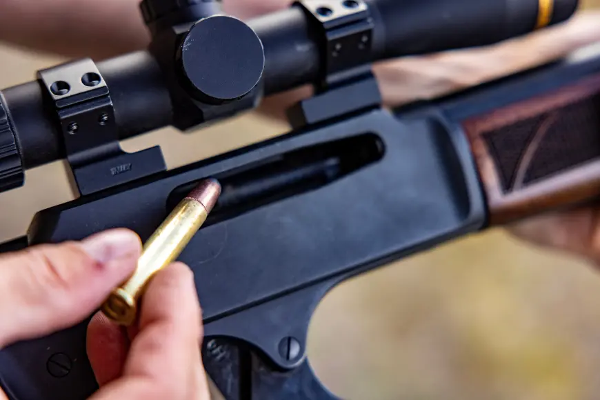 loading a lever-action rifle.