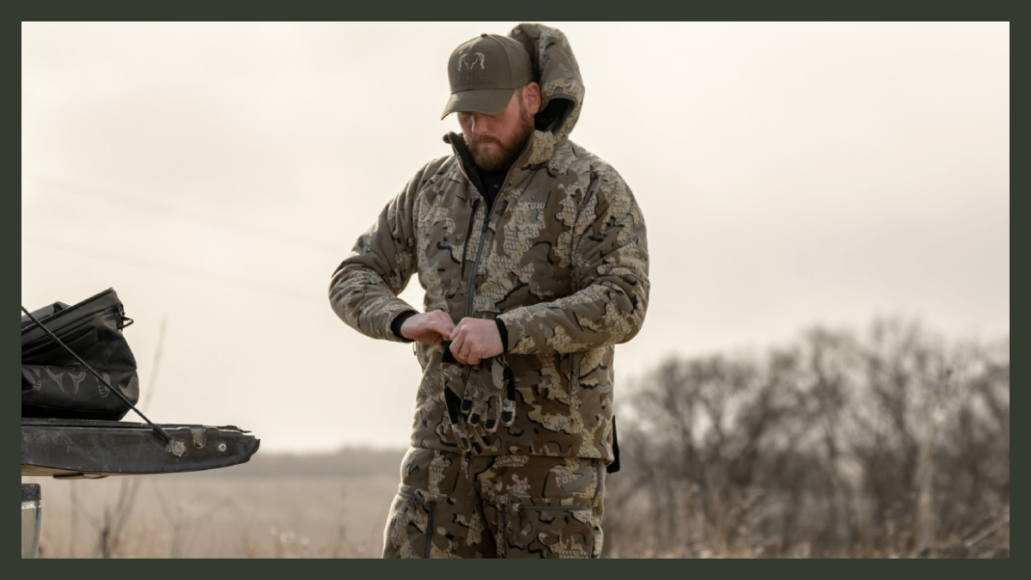 Hunter wearing KUIU Proximity jacket in the field