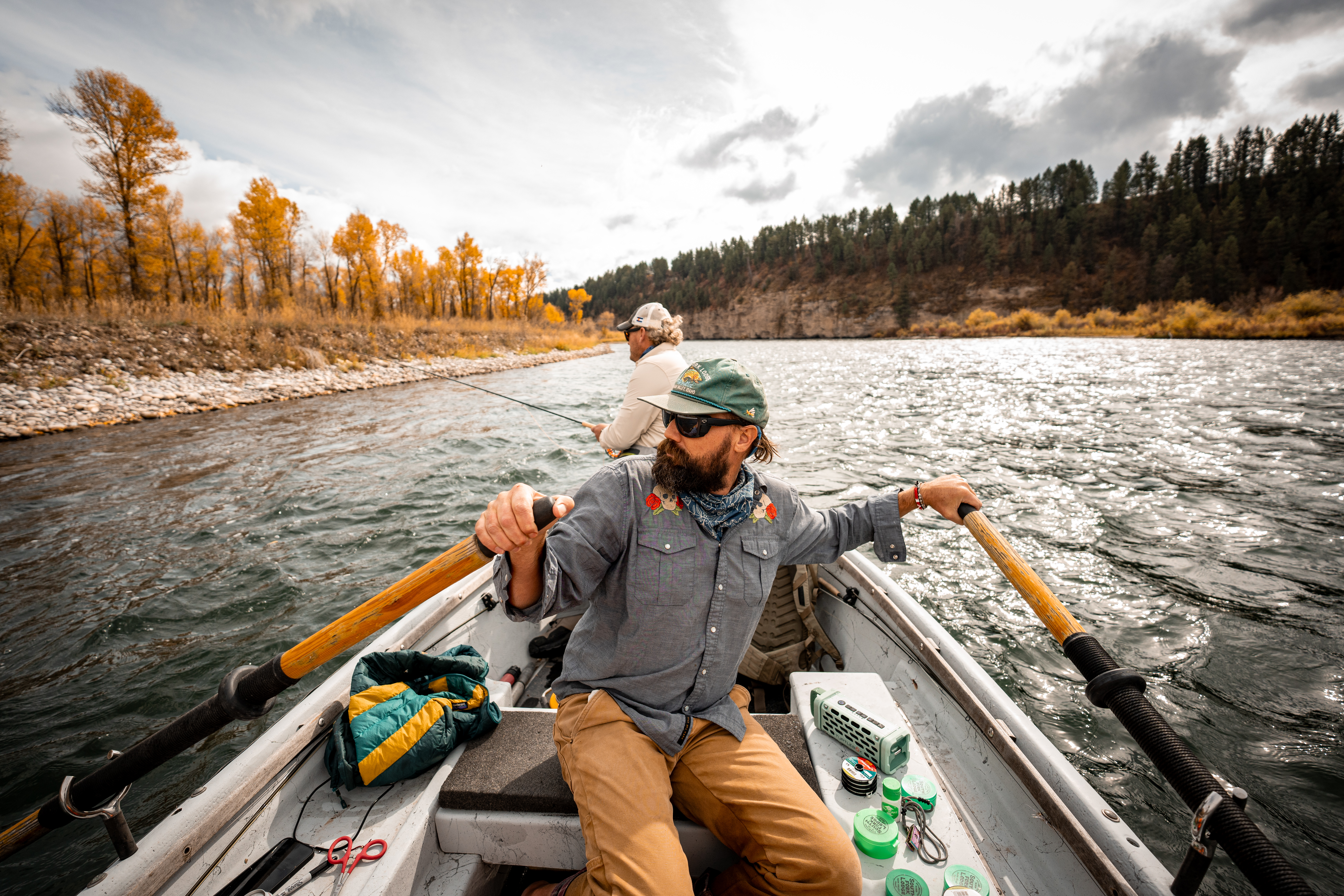 Oliver White rowing a drift boat