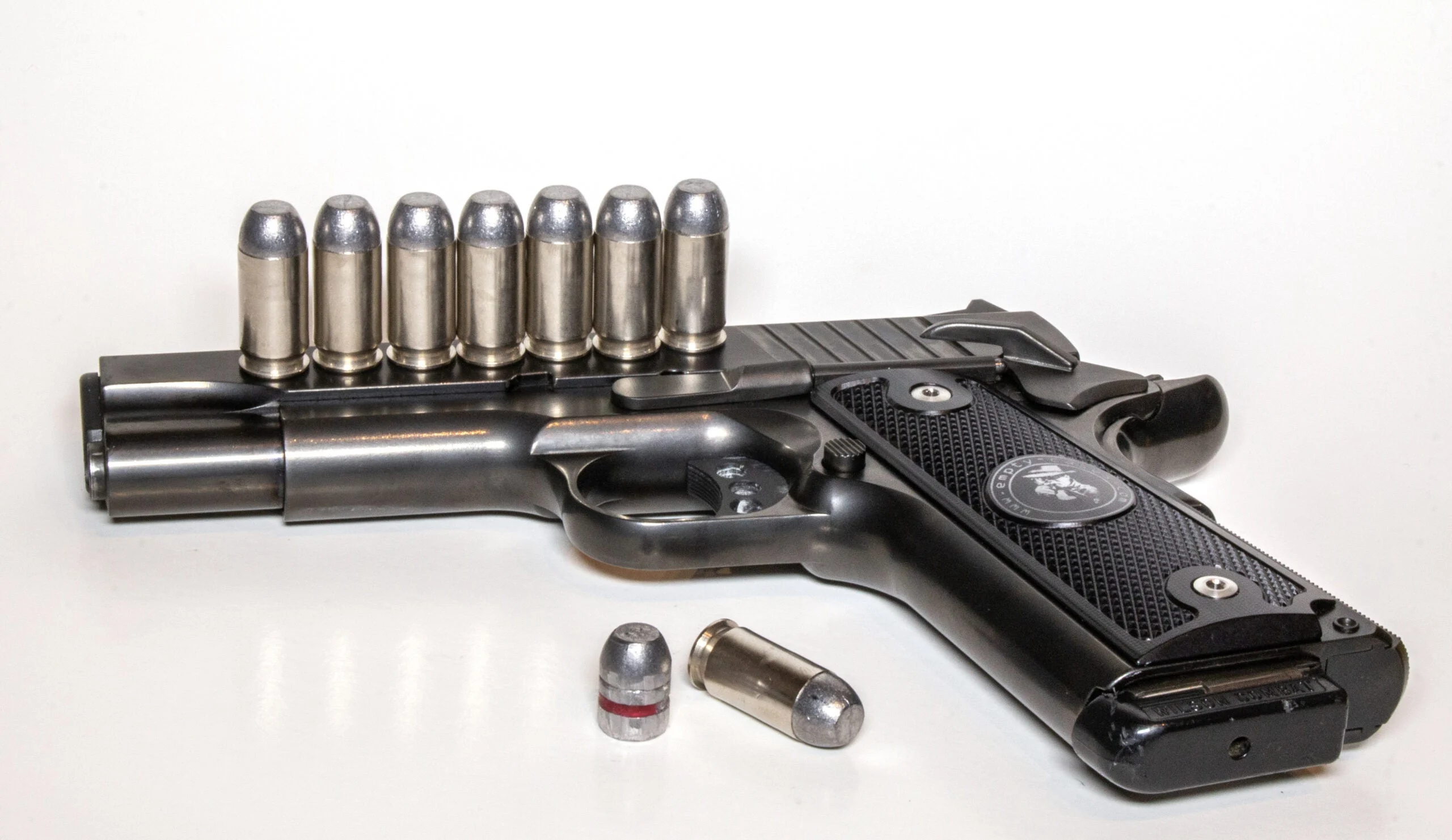 photo of a 45 acp handgun with ammo