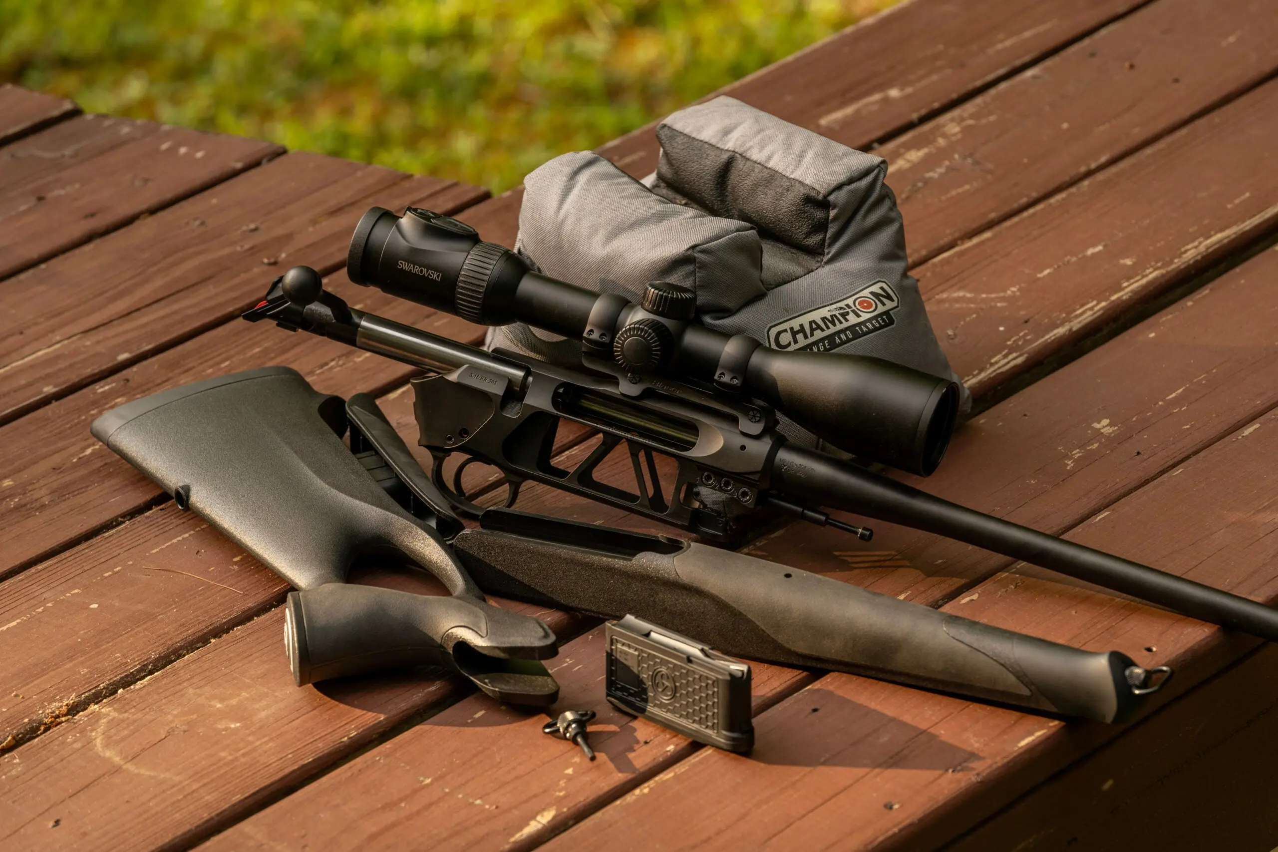 The new Sauer 505 broken down and lying on a shooting bench.