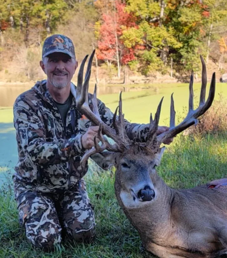 An Ohio huntee poses with a giant whitetail buck. 