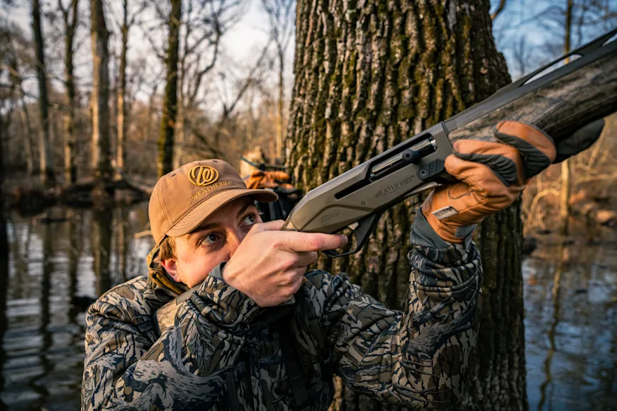 Hunter mounting shotgun