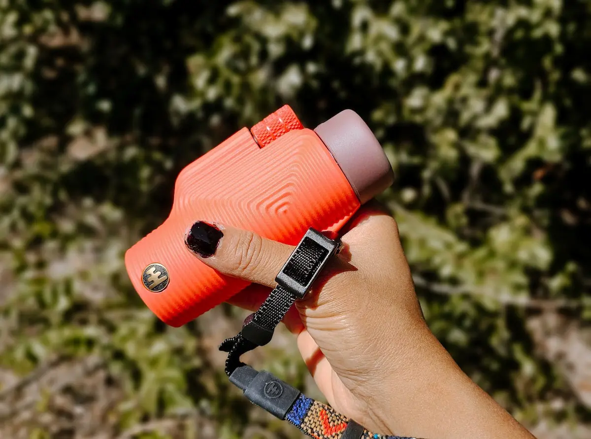 Woman holding Nocs Provisions Zoom Tube Monocular