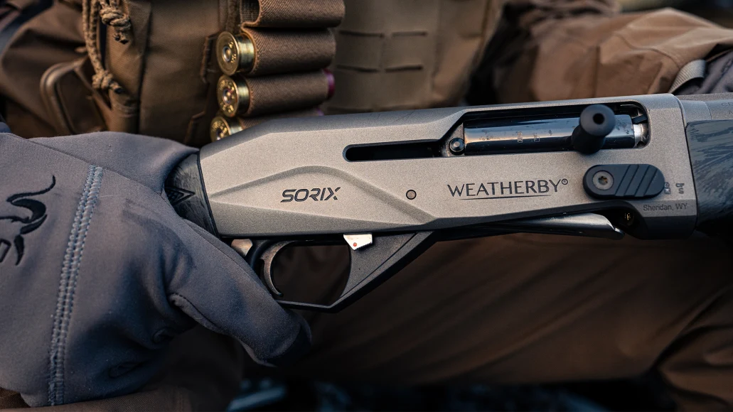 A waterfowl hunter holds theh Weatherby Sorix semiauto shotgun.