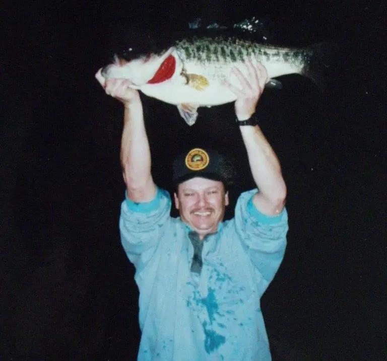 An angler poses with the Louisiana state record largemouth bass. 