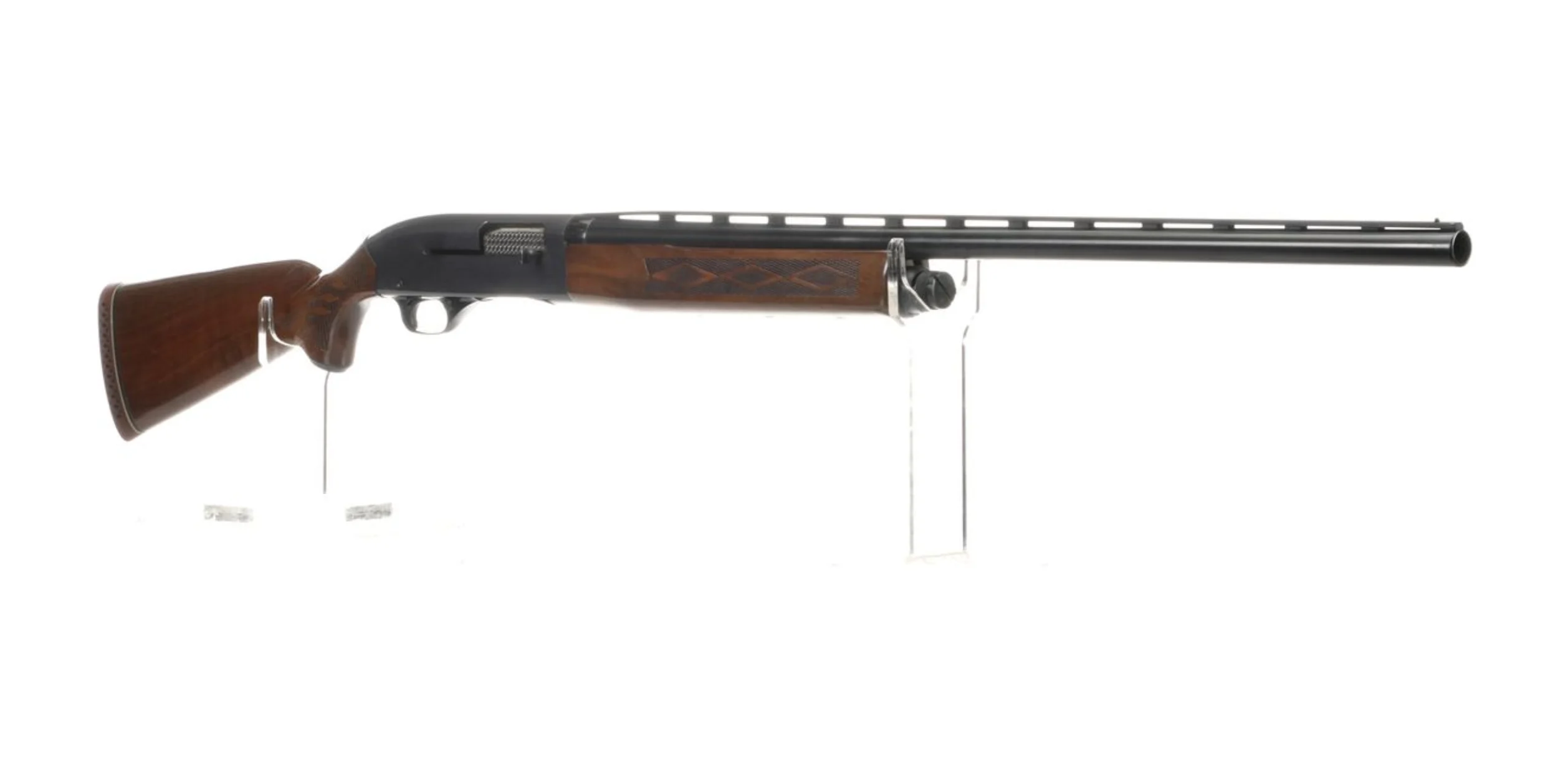 A winchester model 1400 shotgun on a white background.