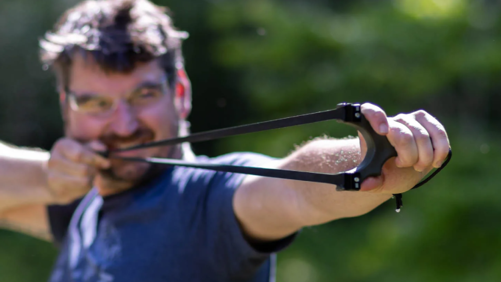 Man pulling back Scout slingshot