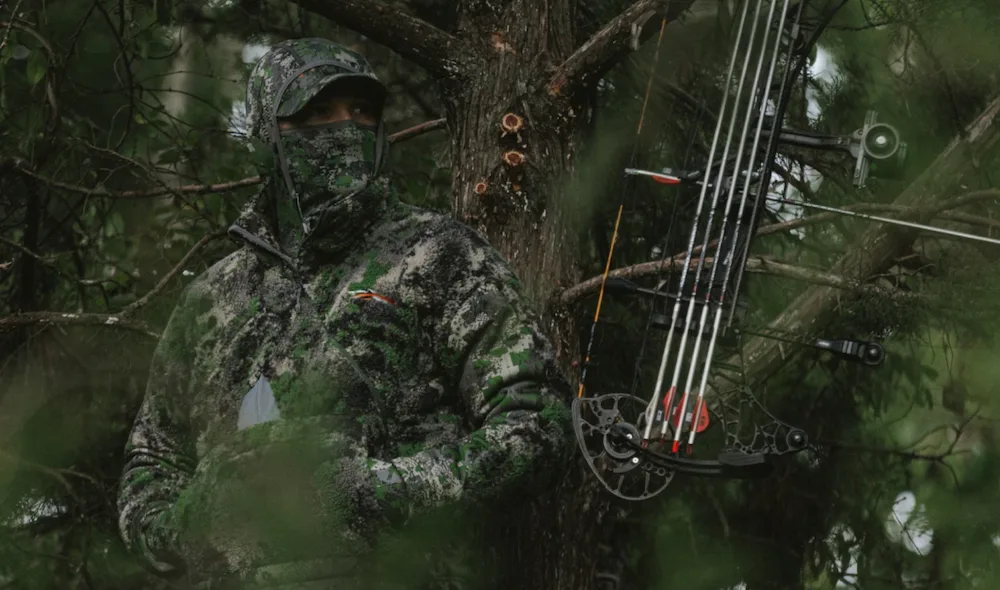 Bowhunter wearing Sitka Optifade Cover Camo Fanatic Jacket