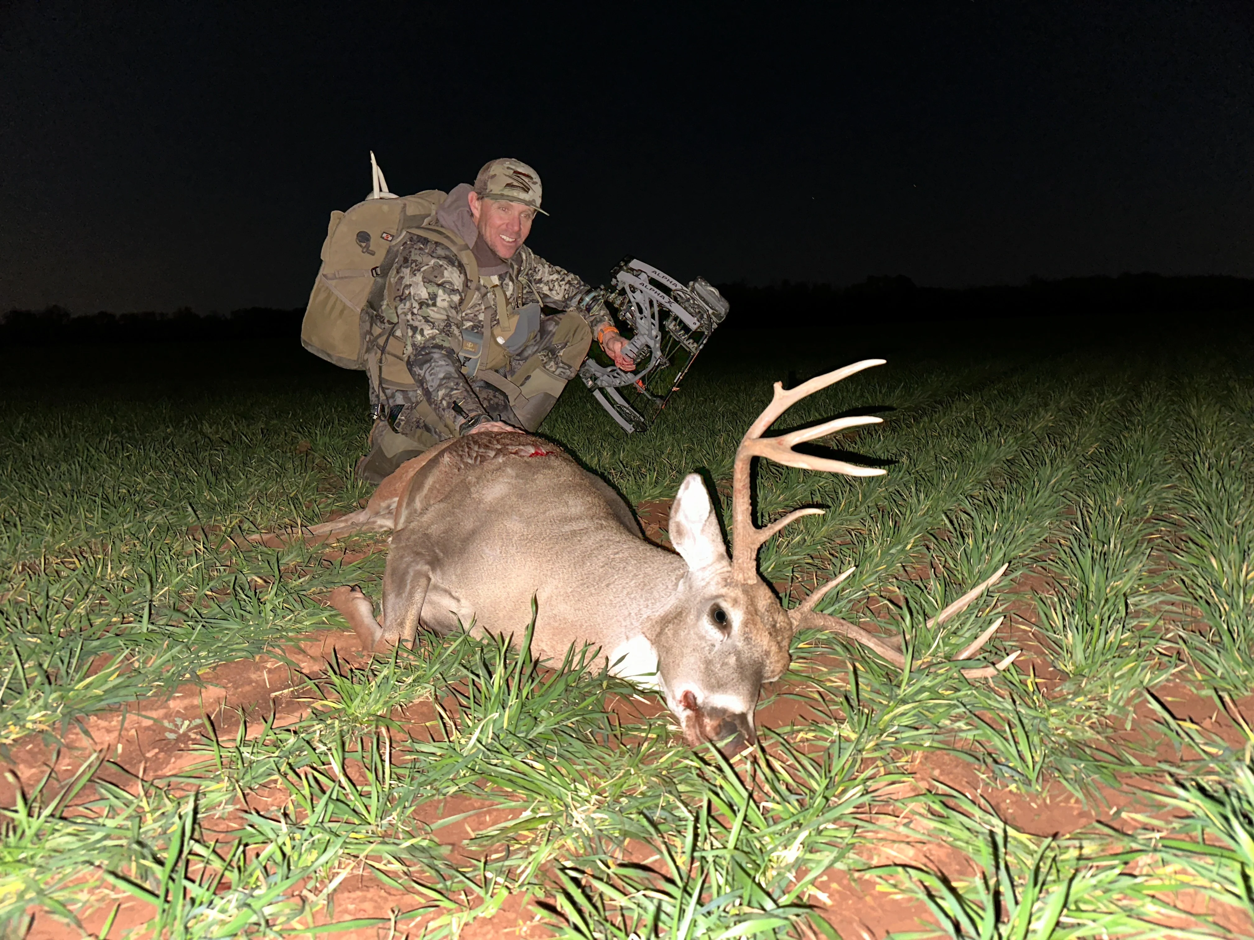 Hunter next to deer