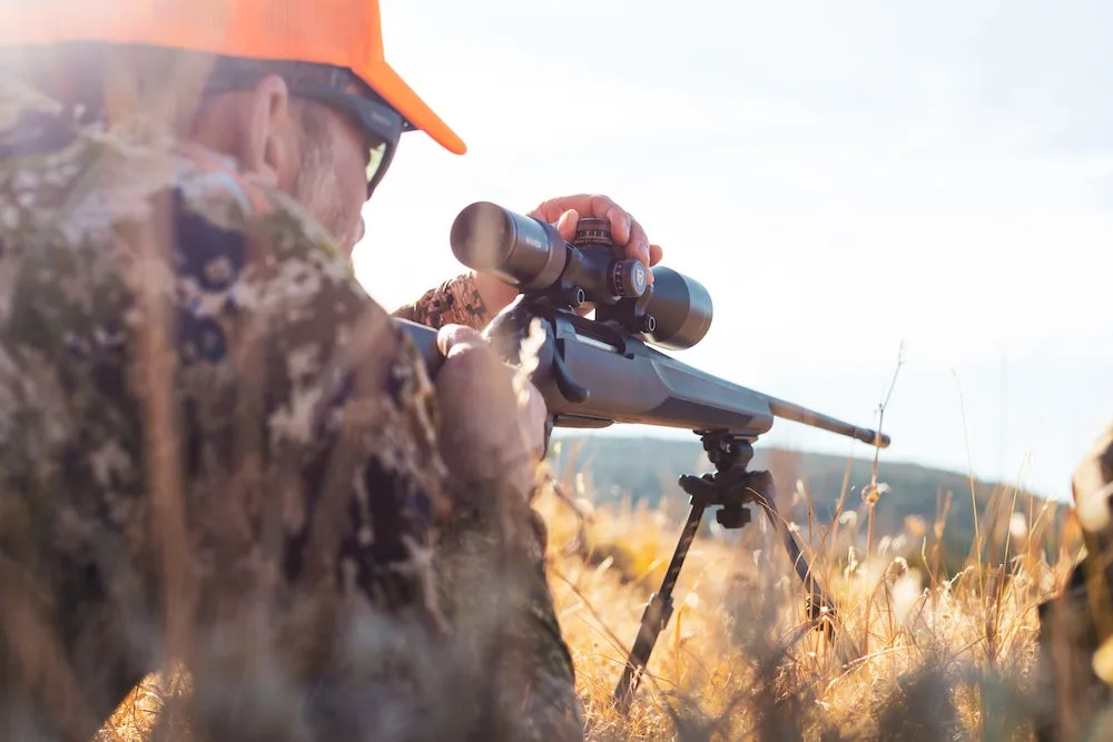 Hunter looking through Maven rifle scope