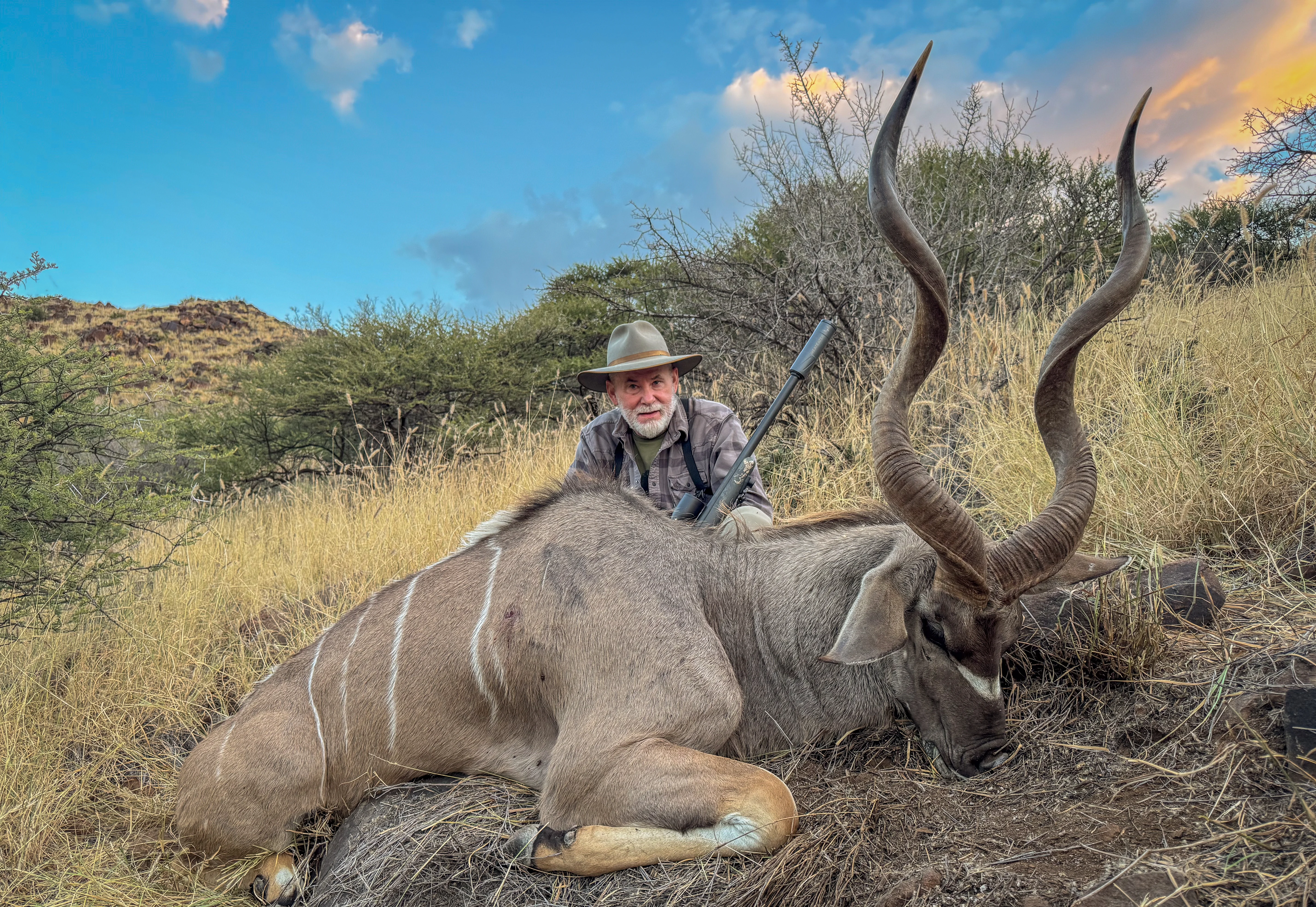 A hunter with a kudu in Africa.