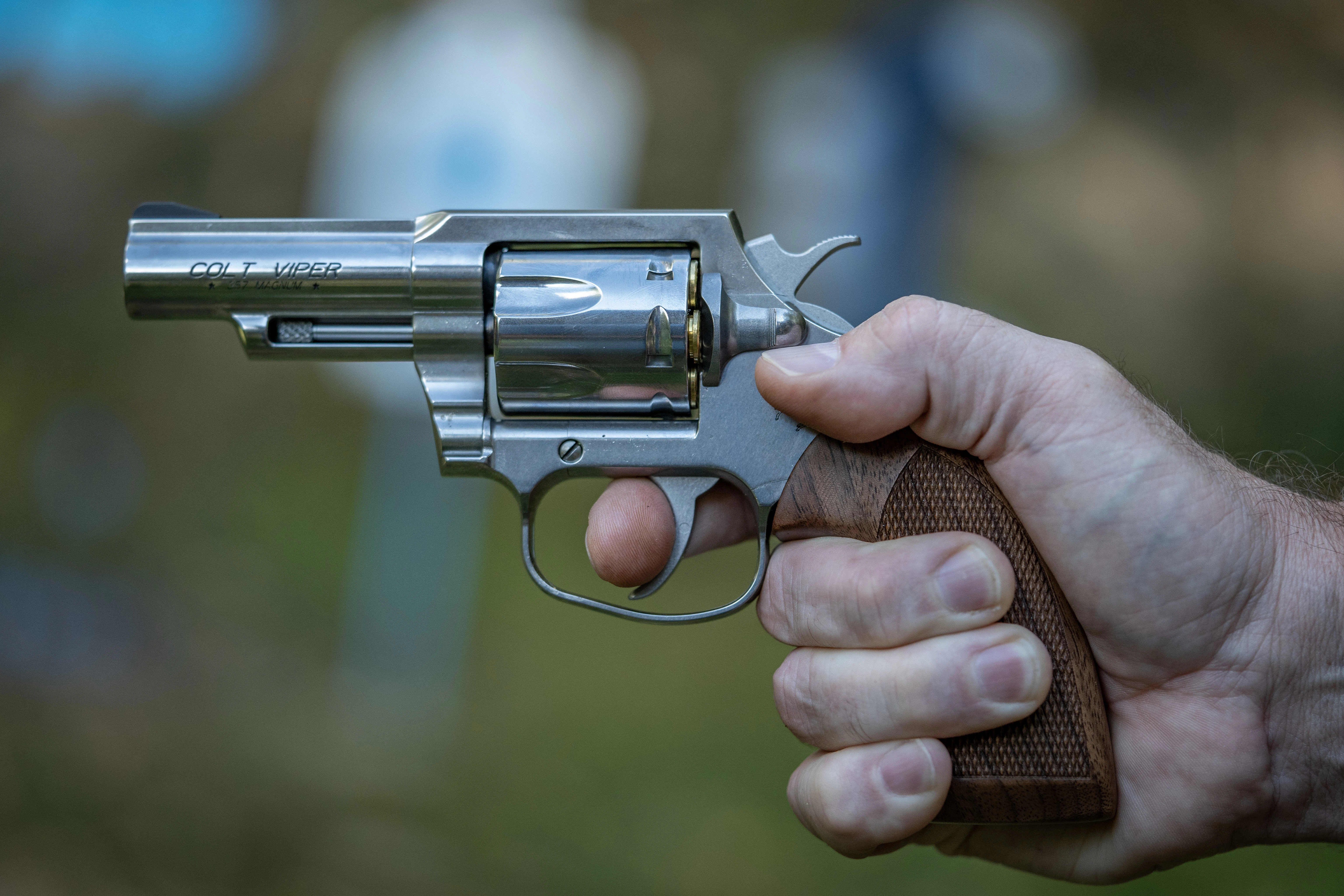 A shooter's hand grips the new Colt Viper revolver. 