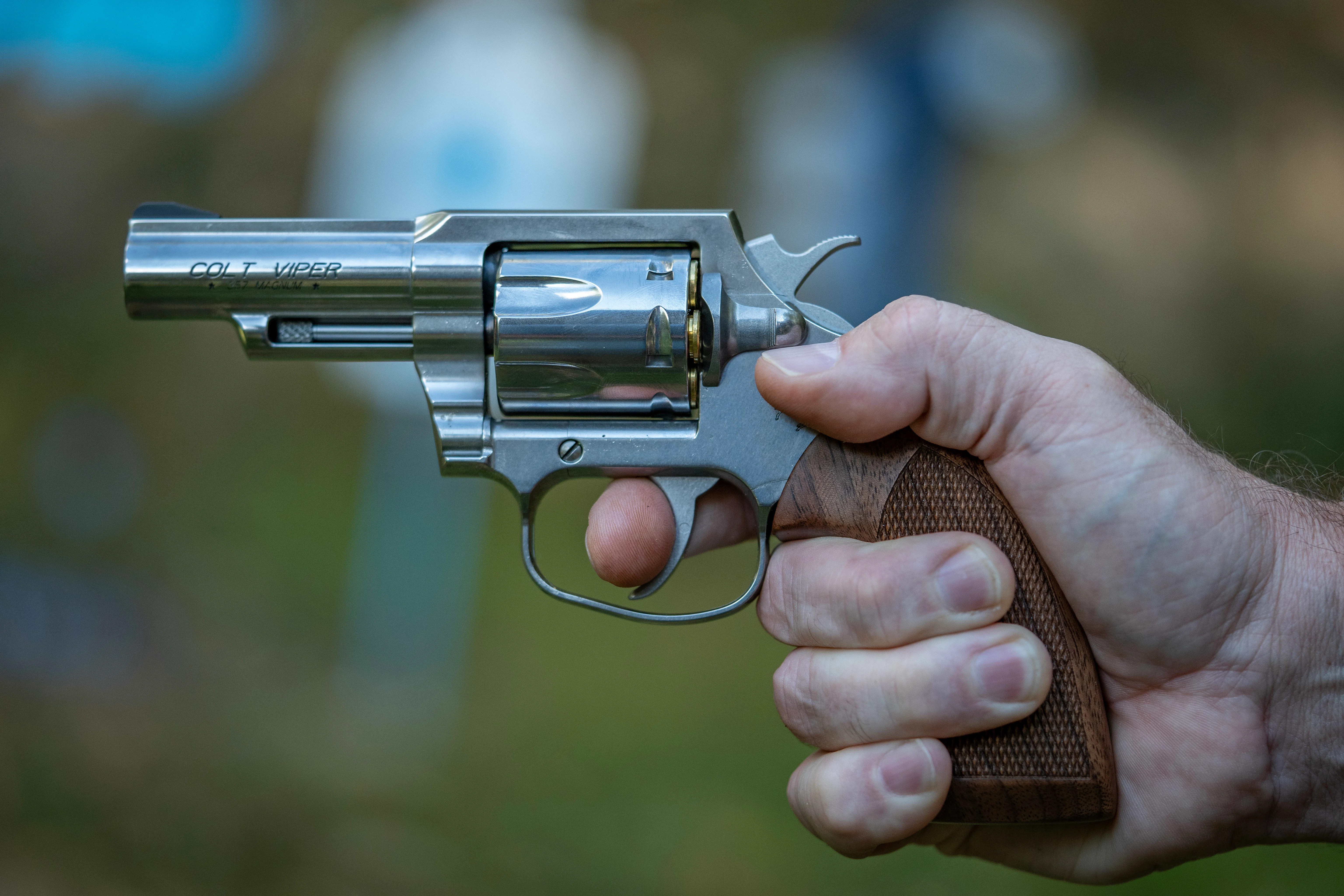 A shooter's hand grips the new Colt Viper revolver. 