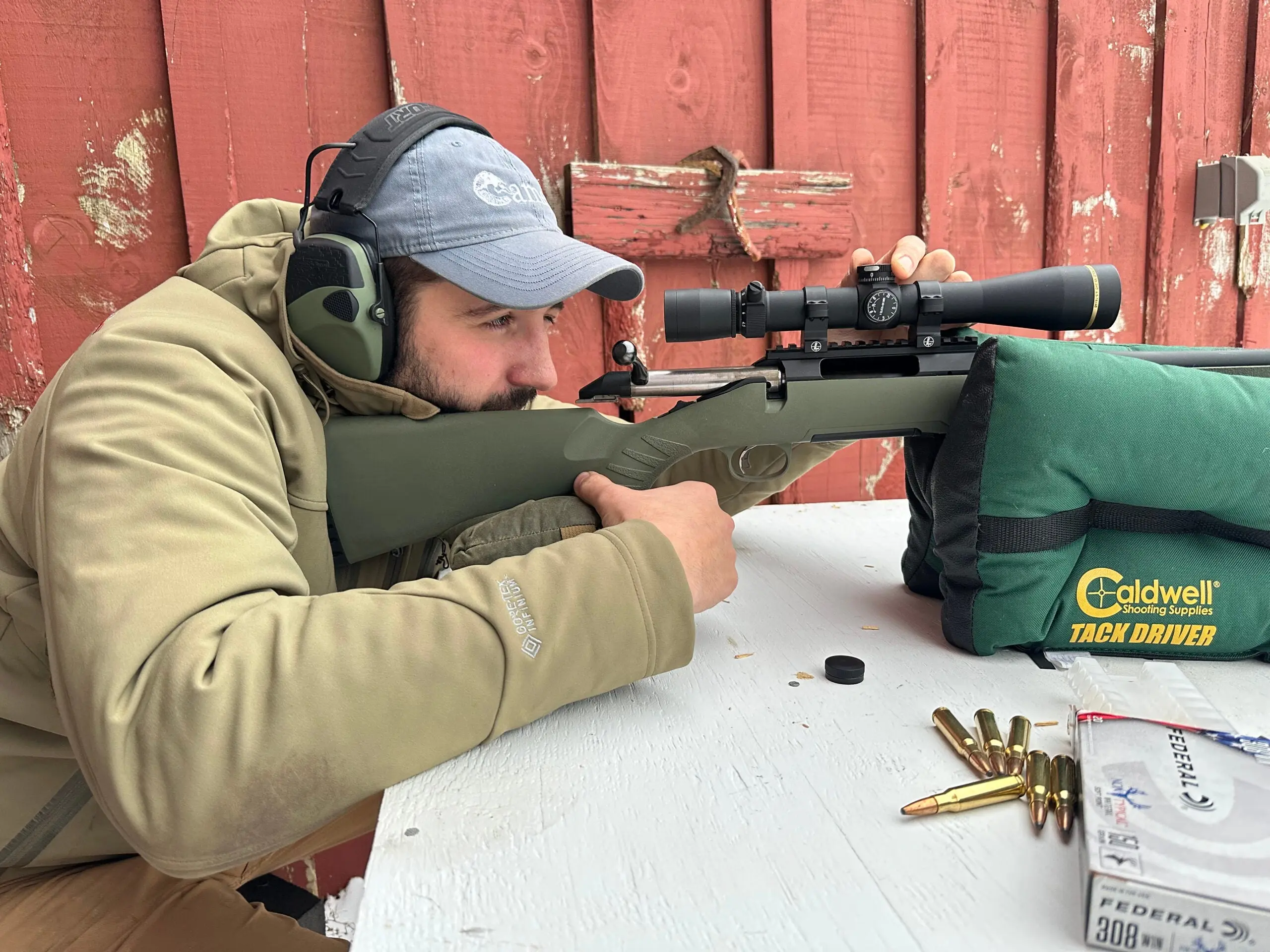 Shooter adjusting a scope turret.