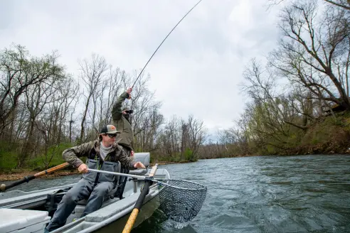 Fly angler in drift boat