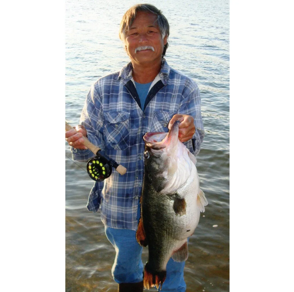 a man holding a fish