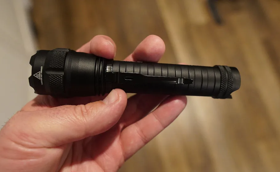 Man holding 5.11 Tactical Response XR1T flashlight in hand