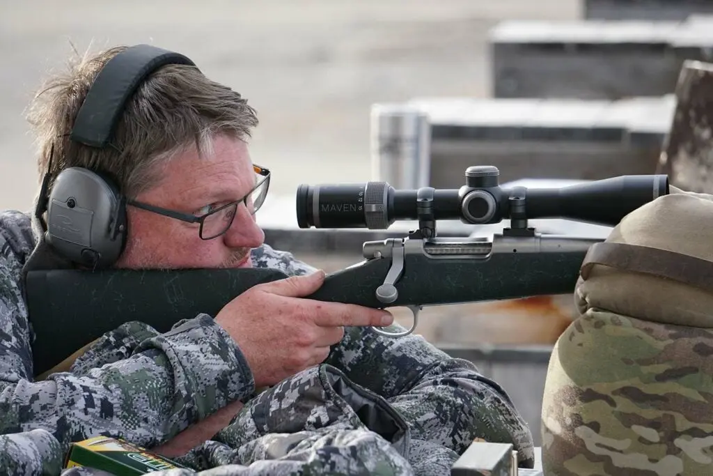 Hunter aiming a Remington model seven rifle in 6.5 Creedmoor.