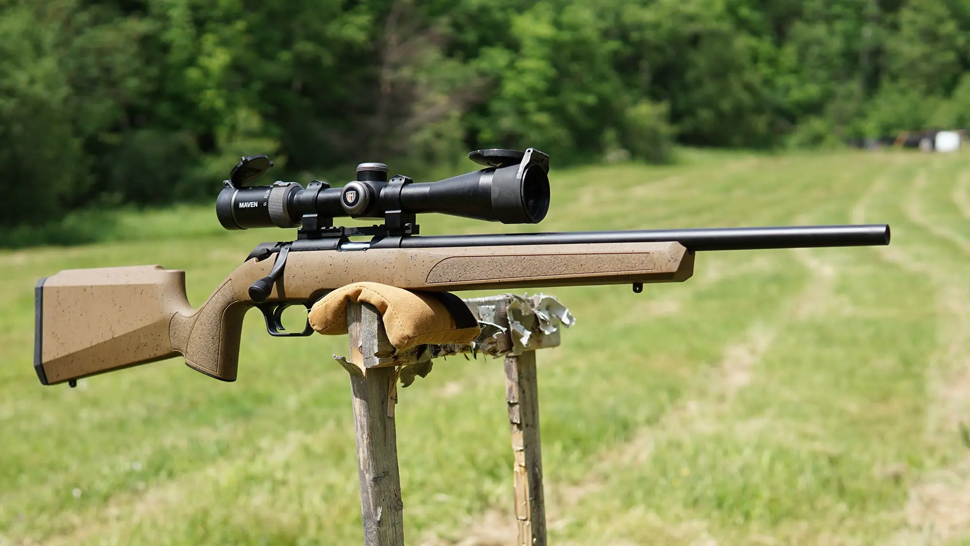 Springfield Model 2020 Rimfire rifle resting on a target stand at a rifle range.