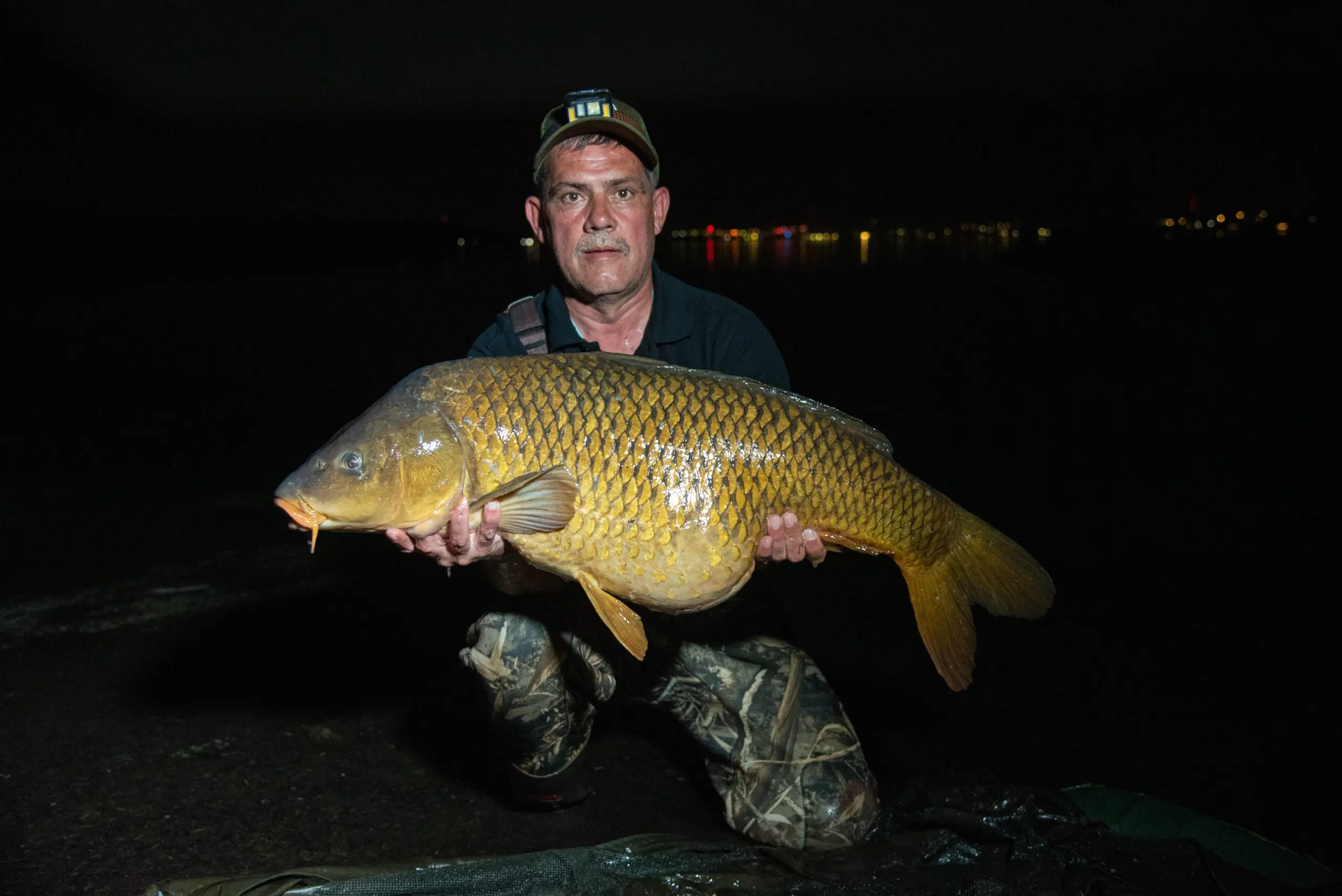 photo of angler with big carp