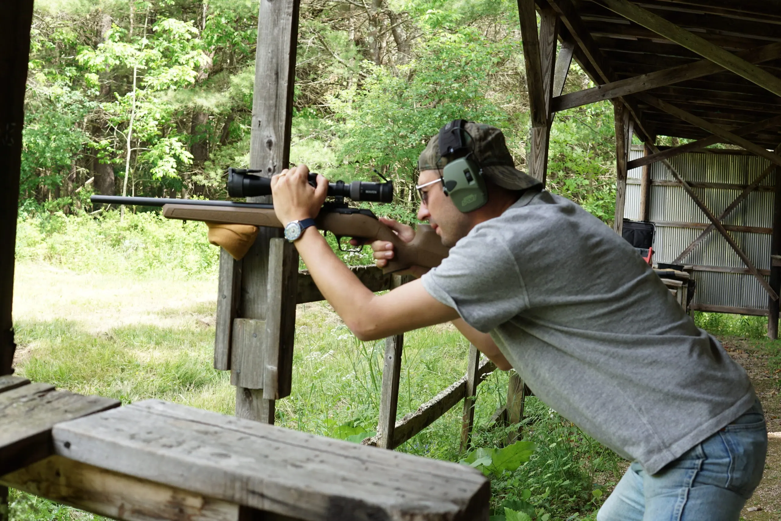 A shooter test fires a Springfield Armory Model 2020 Rimfire rifle from a barricade.
