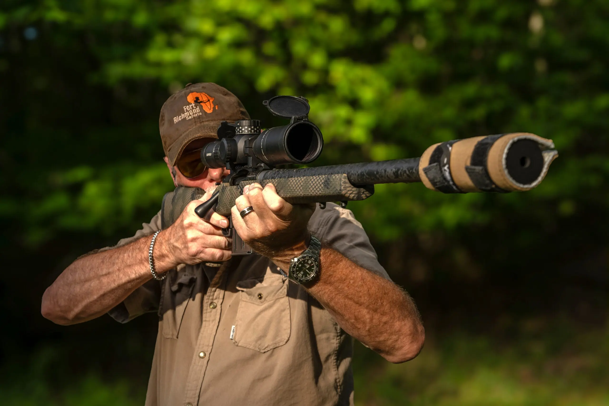 A shooter fires the new Proof Research Elevation 2.0 rifle with suppressor from the offhand position. 